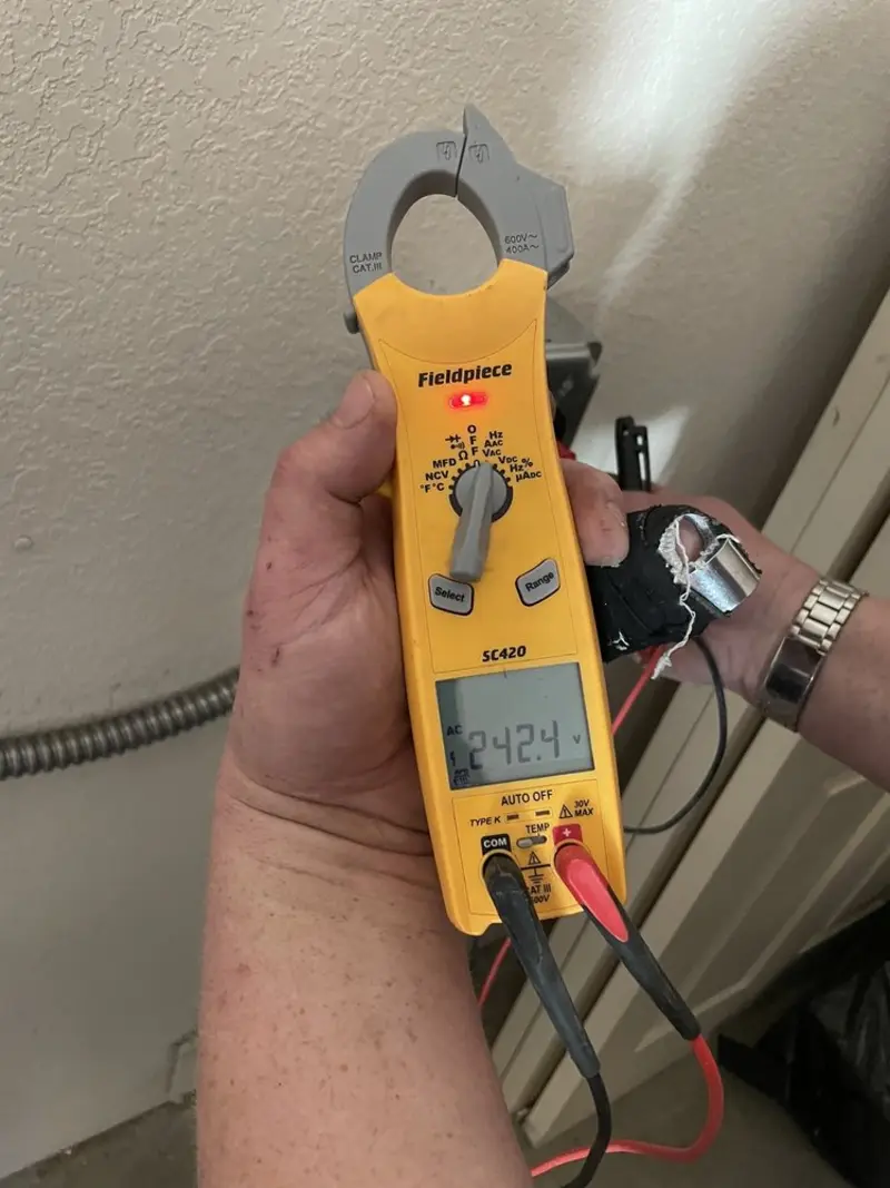 Voltage testing with clamp meter during Ceiling Fan Installation in Lake Jackson